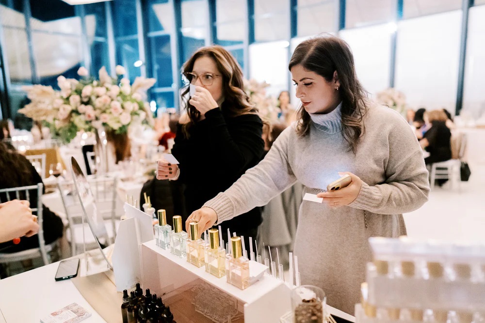 Guests sampling fragrances at the Sillage perfume bar during an event